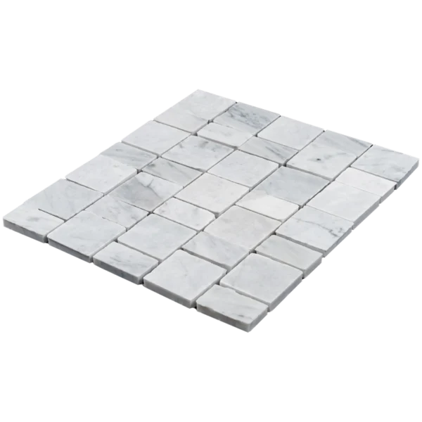 Carrara White Pixel honed marble mosaic — angled perspective showing sheet layout and alignment.