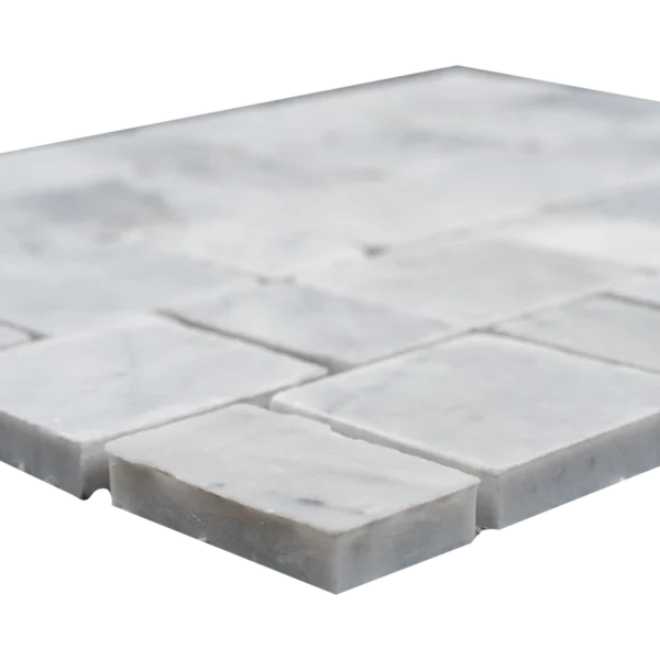 Carrara White Pixel honed marble mosaic — edge detail showing chip thickness and matte honed surface.