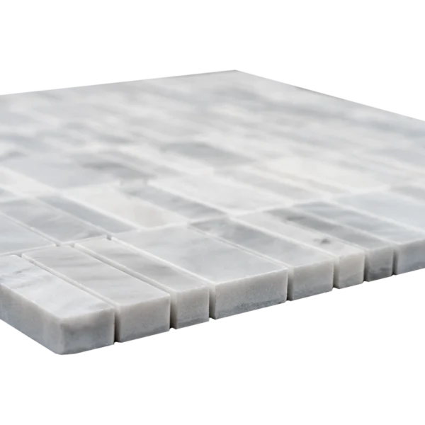 Extreme close-up of the marble strips’ edges, showing the polished face and solid stone thickness.