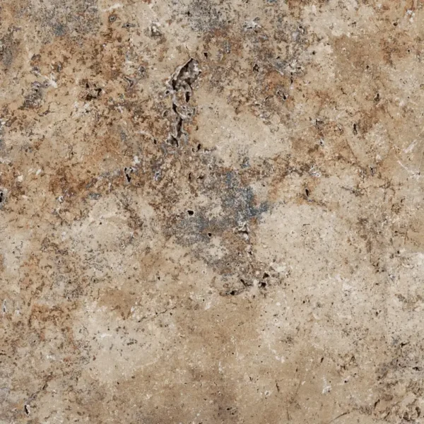 Close-up of Country Classic 16x24 Tumbled Travertine Paver highlighting its rustic brown, tan, and gray surface with natural pits, subtle texture, and earthy variations.