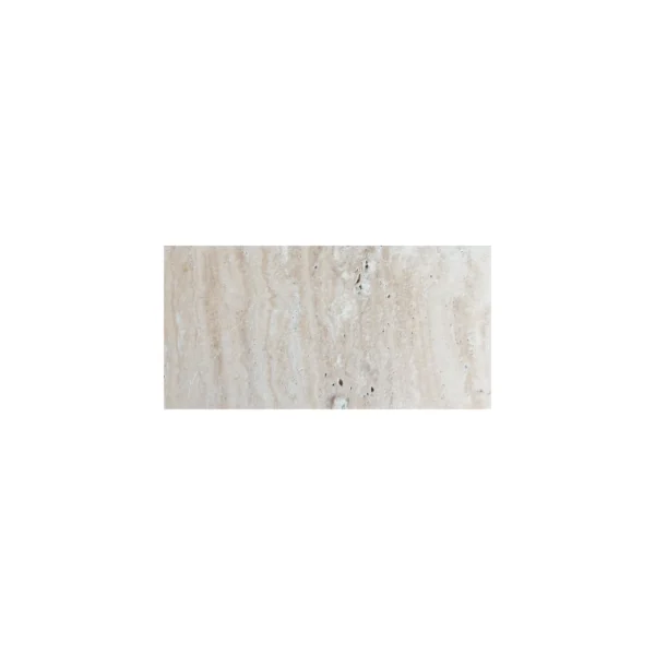 Desert Bloom 6x12 tumbled travertine paver featuring soft beige and cream tones with natural texture and subtle veining, ideal for outdoor flooring and pool decks.