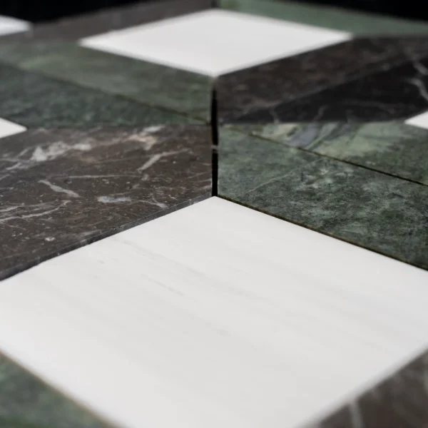 Close-up view of Dolomite, Ruby Green, and Pearl Black star square honed marble mosaic tiles showing detailed veining and smooth finish.