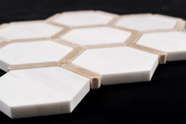 Side close-up of Dolomite with Royal Beige Touch polished marble hexagonal mosaic, highlighting edges, polished finish, and smooth texture.