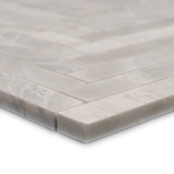 Close-up side view of Iceberg 1x6 honed marble mosaic tiles, highlighting the honed finish, thickness, and natural icy veining.