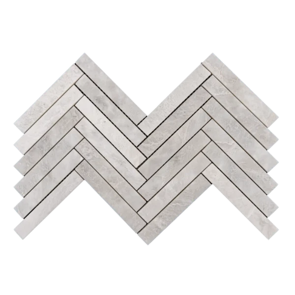 Half sheet of Iceberg 1x6 honed marble mosaic tile in herringbone layout, showing the interlocking design for easy installation.