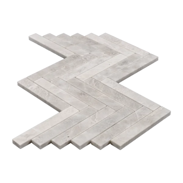 Angled perspective of Iceberg 1x6 honed marble mosaic sheet, showcasing the crisp rectangular strips and herringbone pattern.