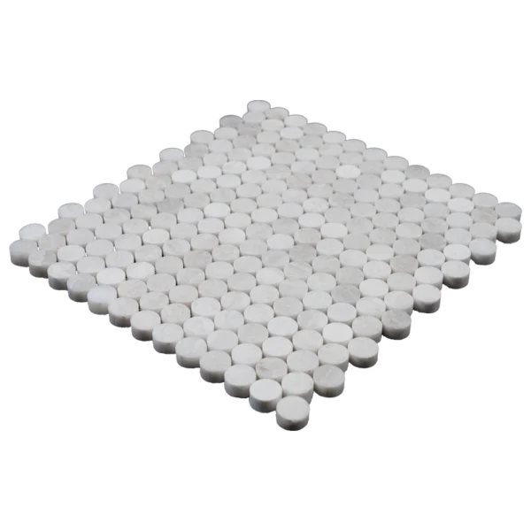 Angled view of Iceberg penny honed marble mosaic tile sheet highlighting polished white marble circles and smooth honed finish.