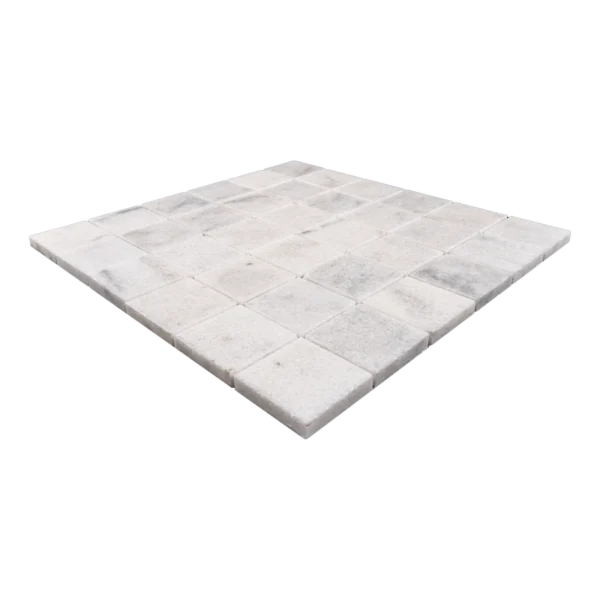 Angled view of Milas White 2x2 polished marble mosaic tile sheet, showing interlocking mesh backing and smooth glossy texture.