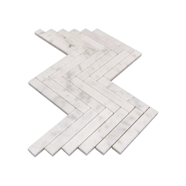 Angled side view of Milas White 1x6 honed marble herringbone mosaic sheet, showing the interlocking layout and thin rectangular pieces.