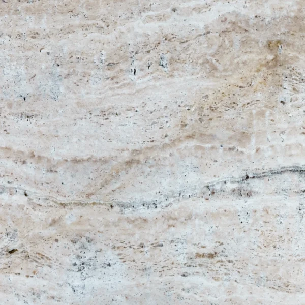 Close-up of Norwegian River 16"x24" tumbled travertine paver—beige and cream base with soft blue-gray swirls, linear bands, natural pits, matte texture.