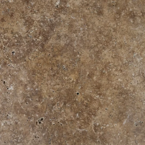 Close view of 16x24 Romano travertine paver featuring earthy coffee and caramel tones with scattered pinholes and weathered tumbled finish.