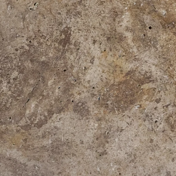 Close-up of 6x12 Romano travertine paver featuring rustic taupe and mocha swirls, characteristic holes, and a softly tumbled finish.