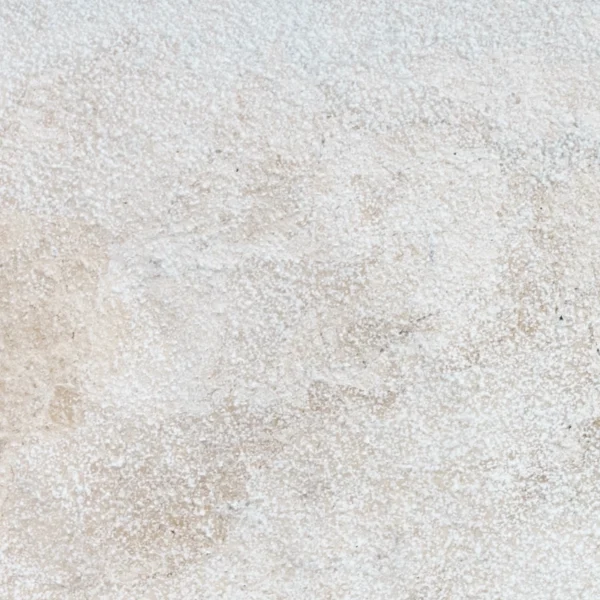 Close-up view of Royal Beige 16x24 leathered marble paver highlighting its soft beige tones and subtly textured leathered surface.