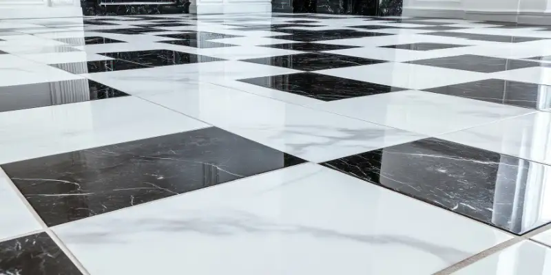 Black and white checkerboard marble flooring in a classic hallway