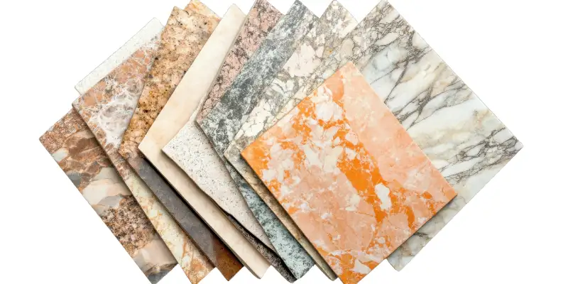 Assorted marble tile flooring choices laid out as a design board
