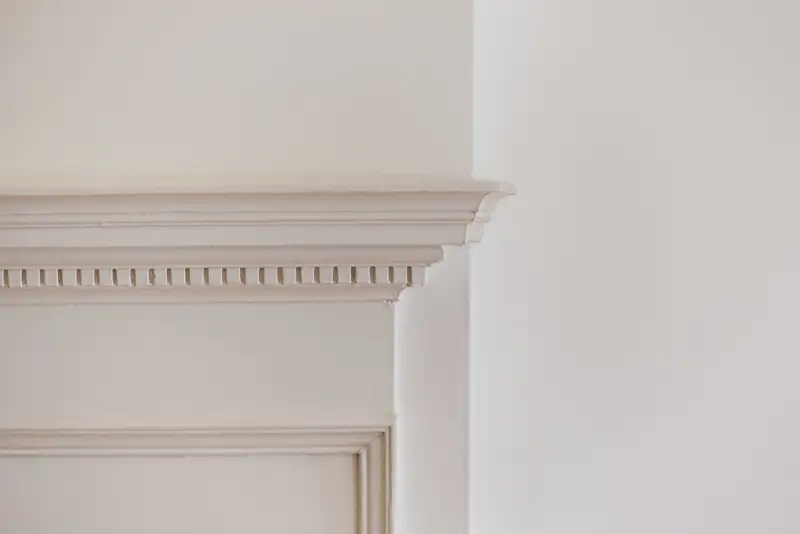 Marble baseboard molding installed at floor edge