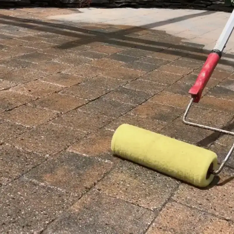 Applying sealer to outdoor stone pavers
