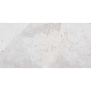 Volakas white marble tile texture with soft gray and beige veining, natural stone surface detail