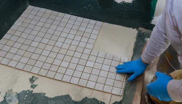 high-angle-view-working-mosaic tiles