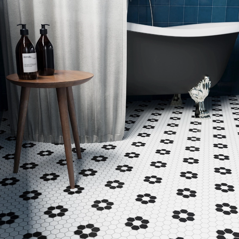 classic beige marble bathroom with mosaic tile walls and floor, freestanding tub and natural light
