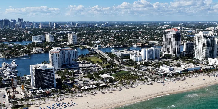 Luxury marble mosaic tile bathroom design in Fort Lauderdale Florida featuring natural stone mosaic shower floor and coastal interior style