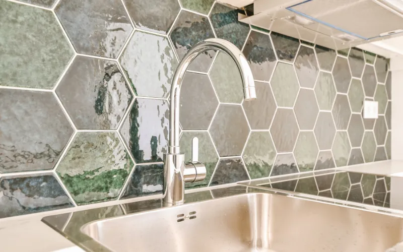 Hexagon mosaic tile backsplash in a modern kitchen