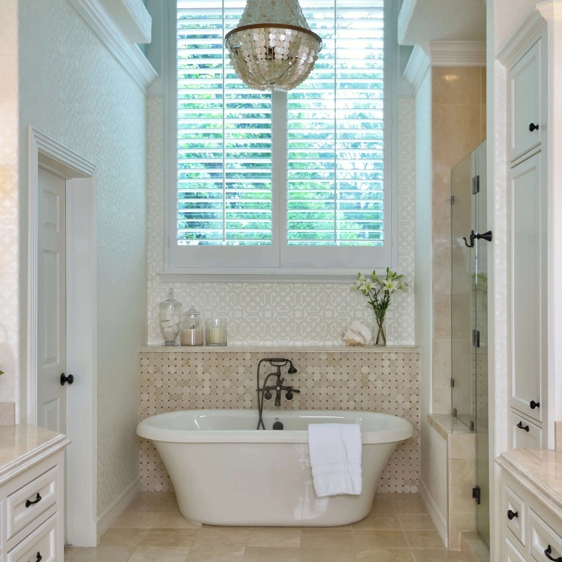 luxury marble bathroom with mosaic tile floor, skylight ceiling, modern bathtub and white vanity design