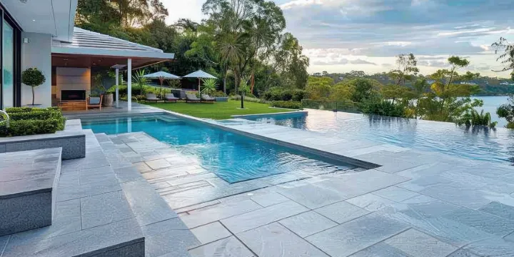 Natural stone pool deck pavers at a modern Tampa Florida outdoor patio and pool area