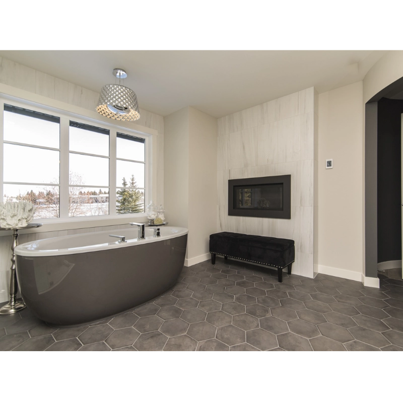 vintage bathroom design with black and white hexagon mosaic tile floor and clawfoot bathtub