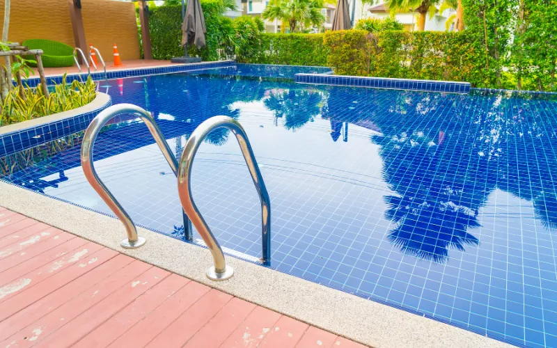 Blue glass mosaic swimming pool tile with reflective water effect
