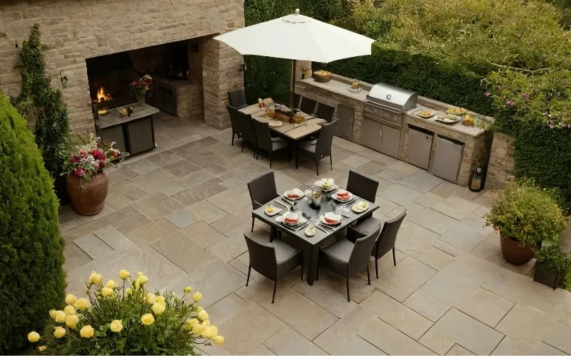 Beige marble pavers installed on an outdoor kitchen and patio