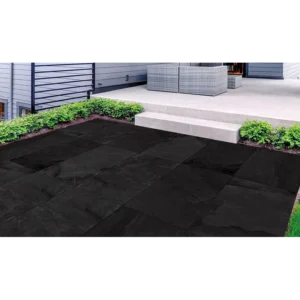 Outdoor setting with Berwyn Charcoal 24x24 porcelain pavers showcasing the natural finish and rectified joints.