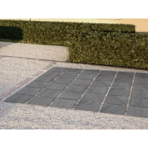 Close-up of Kursaal Extreme Raven 24x24 porcelain paver showing its natural finish and pressed edges for consistent joints.