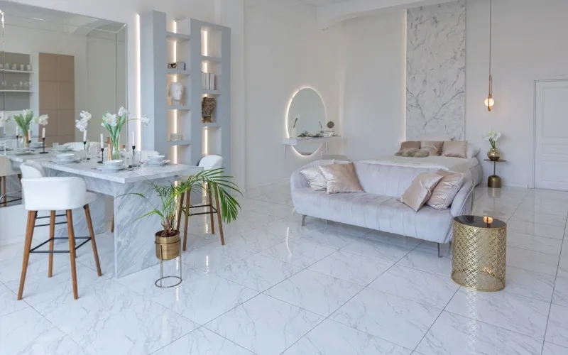 White marble floor tiles installed in an elegant living room with natural gray veining