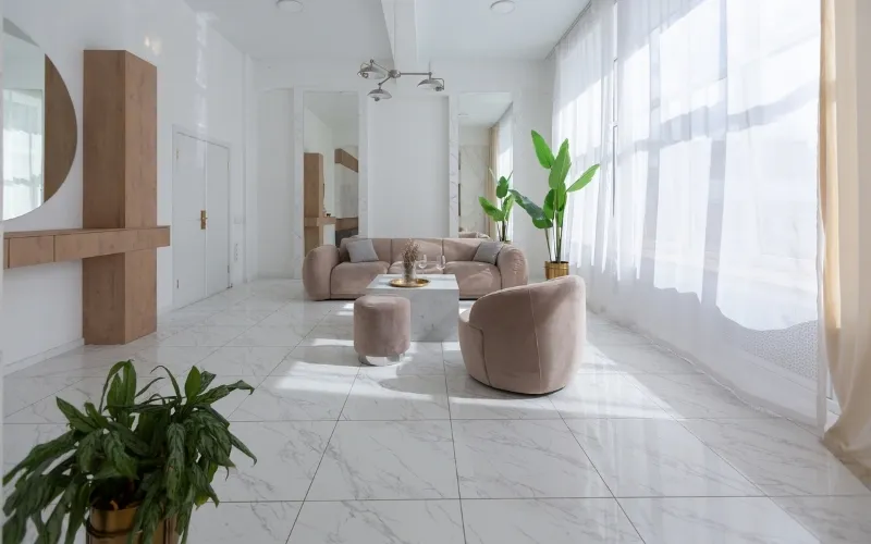 24x24 marble floor tiles installed in an elegant living room with natural stone veining