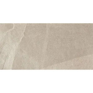 Close-up of X-Rock B 24x48 2CM Grip Sanded Porcelain Paver showing its beige-gray stone-look texture and surface details.