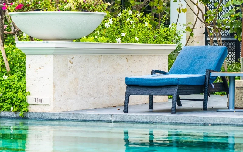 travertine pool deck patio design in Naples Florida with natural stone outdoor flooring