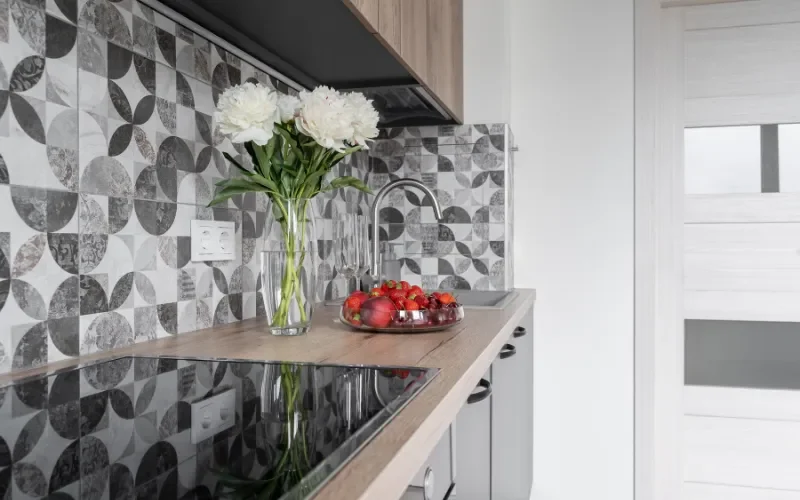 Hexagon mosaic tile backsplash in a modern kitchen design